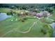Aerial view of a golf course and country club at 7070 Se 14Th Ct, Ocala, FL 34480