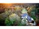 House nestled in a wooded area near a golf course at 7070 Se 14Th Ct, Ocala, FL 34480