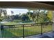 Enjoy tranquil golf course views from this private balcony at 7070 Se 14Th Ct, Ocala, FL 34480