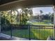 Spacious balcony with golf course views and wrought iron railings at 7070 Se 14Th Ct, Ocala, FL 34480