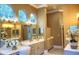 Elegant bathroom with dual vanities, soaking tub and walk-in shower at 7070 Se 14Th Ct, Ocala, FL 34480