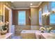 Spa-like Primary bathroom with soaking tub and dual vanities at 7070 Se 14Th Ct, Ocala, FL 34480