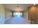 Large bedroom with plush carpeting, access to a private balcony and abundant natural light at 7070 Se 14Th Ct, Ocala, FL 34480