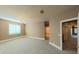 Bright and airy bedroom with neutral wall paint and plush carpeting at 7070 Se 14Th Ct, Ocala, FL 34480