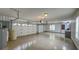 Spacious two-car garage with epoxy flooring and plenty of storage space at 7070 Se 14Th Ct, Ocala, FL 34480