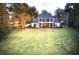 Stunning home with large backyard, screened porch, and balcony at 7070 Se 14Th Ct, Ocala, FL 34480