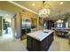 Modern kitchen boasts a spacious island and stainless steel appliances at 7070 Se 14Th Ct, Ocala, FL 34480