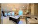 Open kitchen features large island, ample counter space, and stainless steel appliances at 7070 Se 14Th Ct, Ocala, FL 34480