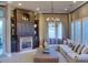 Relaxing living room with a stone fireplace and comfortable seating at 7070 Se 14Th Ct, Ocala, FL 34480