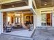 Spacious living room with large windows and access to a patio at 7070 Se 14Th Ct, Ocala, FL 34480