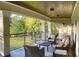 Large covered patio perfect for outdoor relaxation with golf course views at 7070 Se 14Th Ct, Ocala, FL 34480