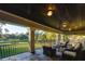 Covered patio furniture with a view of the golf course at 7070 Se 14Th Ct, Ocala, FL 34480