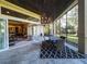 Covered patio with a dining area and views of the backyard at 7070 Se 14Th Ct, Ocala, FL 34480