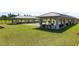 Community bocce ball courts with covered seating areas and benches at 9859 Sw 97Th St, Ocala, FL 34481