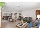 Living room with comfortable seating, a coffee table, and a large window at 9859 Sw 97Th St, Ocala, FL 34481