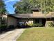 House exterior with driveway and well-maintained lawn at 3824 Ne 17Th Street Cir, Ocala, FL 34470