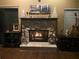Cozy fireplace with stone surround, adding warmth to the living room at 3824 Ne 17Th Street Cir, Ocala, FL 34470