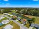 Aerial view of a house located near a golf course and a pond at 17855 Se 99Th Ave, Summerfield, FL 34491