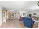 Spacious living room with tile floors, comfortable seating, and dining area at 17855 Se 99Th Ave, Summerfield, FL 34491