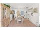 Spacious dining area with a wooden table and chairs at 17855 Se 99Th Ave, Summerfield, FL 34491