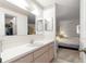 Bathroom with double vanity and view to bedroom at 17855 Se 99Th Ave, Summerfield, FL 34491