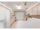 Bright kitchen features ample cabinetry, and a spacious island at 17855 Se 99Th Ave, Summerfield, FL 34491