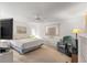 Large main bedroom with a king-size bed and ceiling fan at 17855 Se 99Th Ave, Summerfield, FL 34491