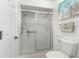 Simple bathroom with shower and toilet at 17855 Se 99Th Ave, Summerfield, FL 34491