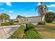 House exterior view with landscaping and driveway at 17855 Se 99Th Ave, Summerfield, FL 34491