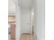Clean hallway with tile floor and doors to bedrooms and bath at 17855 Se 99Th Ave, Summerfield, FL 34491