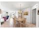 Bright dining room with a table and chairs, view to living room at 17855 Se 99Th Ave, Summerfield, FL 34491