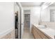 Bathroom with a vanity, shower, and access to walk in closet at 17855 Se 99Th Ave, Summerfield, FL 34491