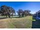 View of backyard with pond and mature trees at 4415 Sw 52Nd Cir # 101, Ocala, FL 34474