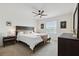 Bright bedroom with a king-size bed, nightstands, and a ceiling fan at 141 Claire Ln, Davenport, FL 33837