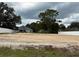 Prepped lot ready for new construction with a view of a completed home at 11610 Sw 59Th Terrace, Ocala, FL 34476