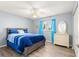 Bedroom with a queen-size bed and dresser at 17784 Se 108Th Ave, Summerfield, FL 34491