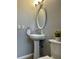 Clean bathroom with pedestal sink and toilet at 3545 E Fort King St # 154, Ocala, FL 34470