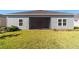 House exterior with screened porch and grassy backyard at 7930 Sw 74Th Loop, Ocala, FL 34481