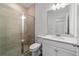 Clean bathroom with a walk-in shower, toilet and vanity with quartz countertop at 7930 Sw 74Th Loop, Ocala, FL 34481