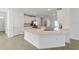 Modern kitchen with white cabinets, quartz countertops, and stainless steel appliances at 7930 Sw 74Th Loop, Ocala, FL 34481
