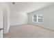 Spacious bedroom with carpeted floor and large window at 7930 Sw 74Th Loop, Ocala, FL 34481