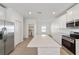 Spacious kitchen with stainless steel appliances and white cabinets at 7930 Sw 74Th Loop, Ocala, FL 34481
