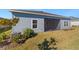 House exterior showcasing a screened patio and landscaping at 7930 Sw 74Th Loop, Ocala, FL 34481