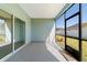 Relaxing screened porch with sliding glass doors and backyard view at 7930 Sw 74Th Loop, Ocala, FL 34481