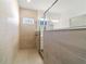Walk-in shower with tiled walls and floor at 7930 Sw 74Th Loop, Ocala, FL 34481