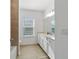 Clean bathroom with vanity, mirror, and tile shower/tub at 7930 Sw 74Th Loop, Ocala, FL 34481