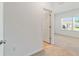 Clean hallway with doors to bedrooms and a window at 7930 Sw 74Th Loop, Ocala, FL 34481