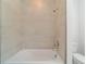 Bathroom with a shower/tub combo and tile surround at 7930 Sw 74Th Loop, Ocala, FL 34481