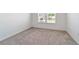 Spacious bedroom with large window and neutral decor at 7930 Sw 74Th Loop, Ocala, FL 34481