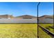 Grass backyard with white vinyl fence and neighboring homes at 7930 Sw 74Th Loop, Ocala, FL 34481